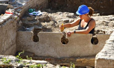An archaeologist works at Portus